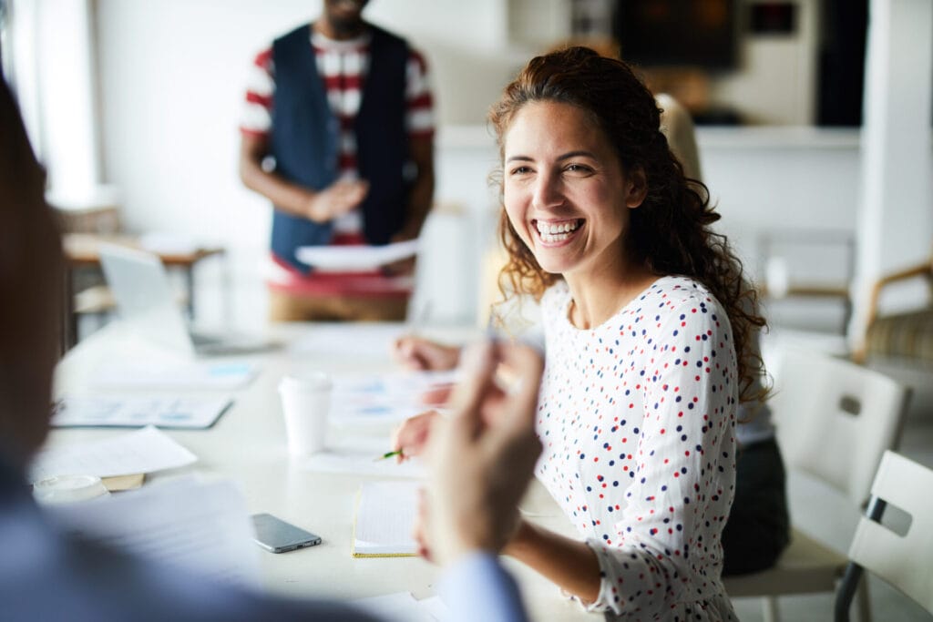 Happy businesswoman at meeting